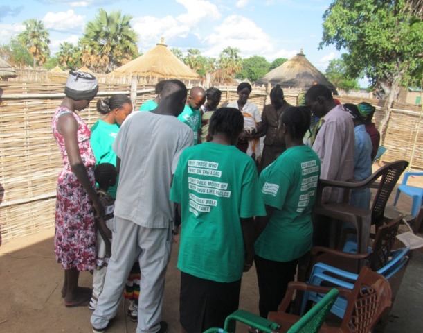 Medical Team Praying with the Residents of Hyzindia